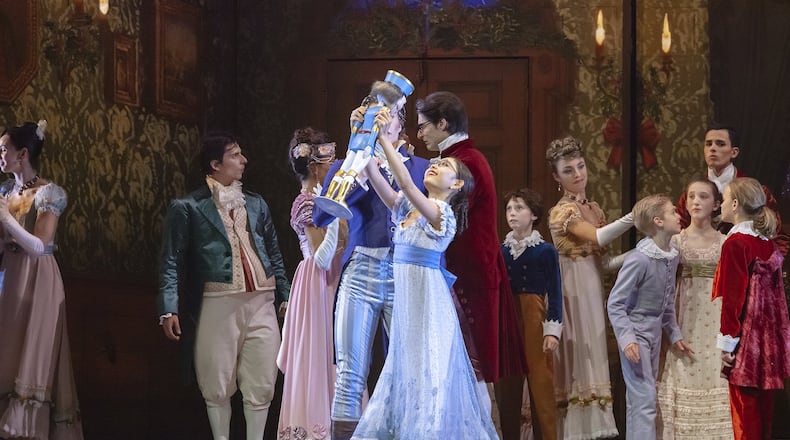 As young Marie, Remi Nakano receives the gift of a nutcracker in Atlanta Ballet’s eponymous version of the holiday classic, making its final run at the Fox Theatre. Contributed by Kim Kenney