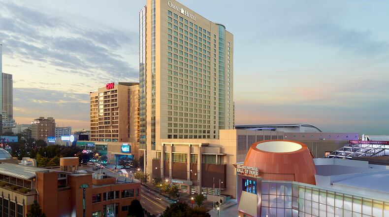 Dallas-based Omni Hotels & Resorts said Thursday it has purchased Time Warner's 50 percent stake in downtown Atlanta's Omni Hotel at CNN Center.