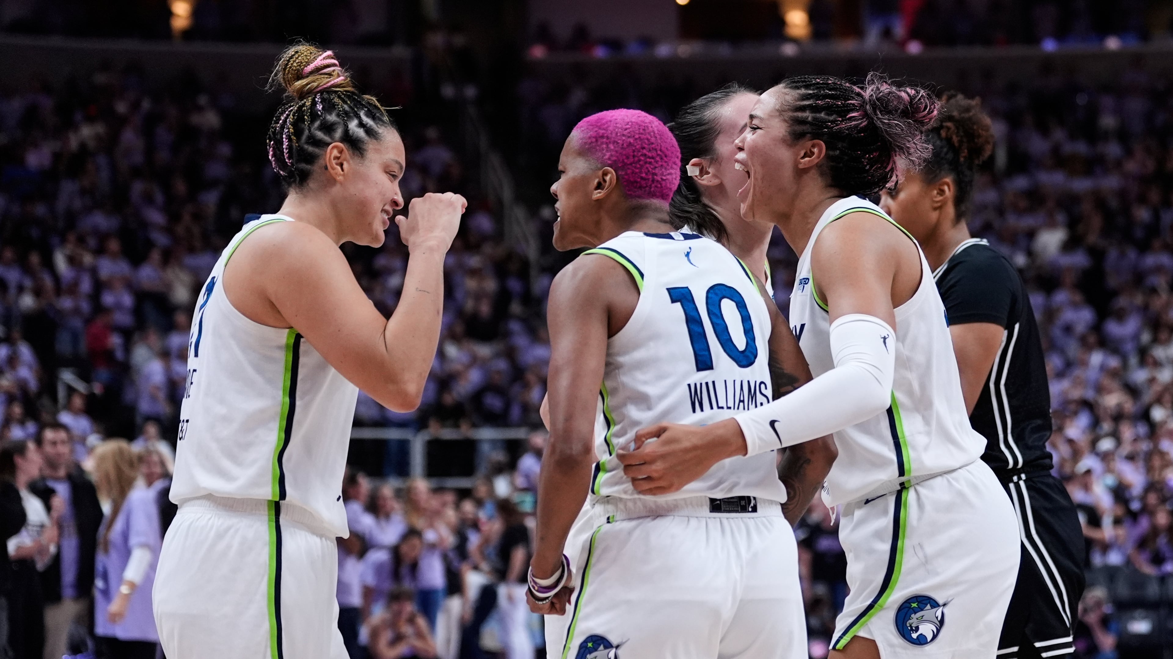 From left, Minnesota Lynx's Kayla McBride, Courtney Williams and Napheesa Collier celebrate after the team's victory over the Golden State Valkyries in the first round of the WNBA basketball playoffs Wednesday, Sept. 17, 2025, in San Jose, Calif. (AP Photo/Godofredo A. Vásquez)