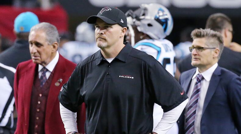 122815 ATLANTA: Falcons owner Arthur Blank (from left), head coach Dan Quinn, and general manager Thomas Dimitroff watch the team warmup before playing the Panthers in a football game on Sunday, Dec. 27, 2015, in Atlanta. The Falcons are looking to play better than in their rematch after a recent 38-0 loss to the Panthers in Charlotte. Curtis Compton / ccompton@ajc.com