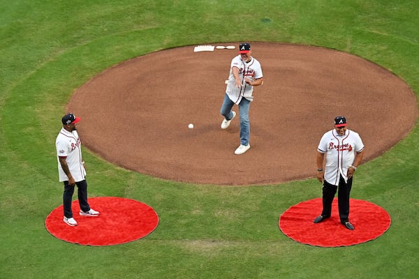 Atlanta Braves baseball great Chipper Jones throws out the ceremonial first pitch of the MLB All-Star Game at Truist Park on Tuesday. (Hyosub Shin/AJC)