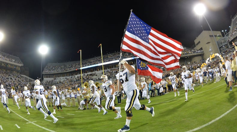October 21, 2017 Atlanta - Georgia Tech's Ramblin' Wreck leads the band, cheerleaders, Buzz, players, and coaches before the start of the Georgia Tech home game against the Wake Forest during an NCAA college football game at Bobby Dodd Stadium on Saturday, October 21, 2017. HYOSUB SHIN / HSHIN@AJC.COM