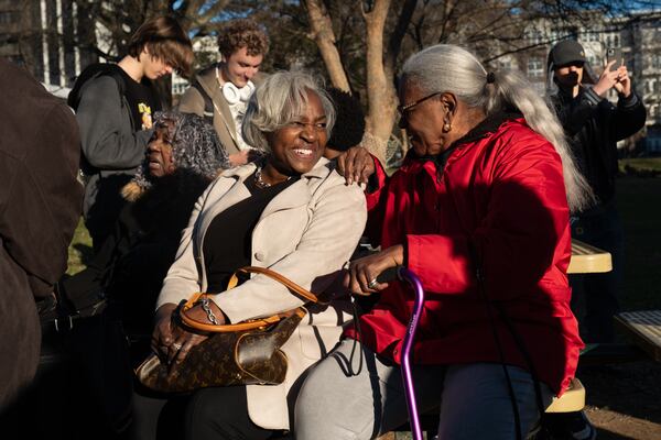 Wanda Sims Watters (left) catches up with Annette Shanks before a news conference on Friday, Jan. 16, 2026. Some said Friday that the school district had other locations available for an early learning center. (Ben Gray for the AJC)