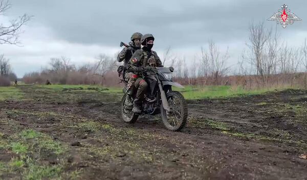 In this photo taken from video distributed by Russian Defense Ministry Press Service on Monday, April 14, 2025, Russian servicemen attend a combat training for assault units in an undisclosed location. (Russian Defense Ministry Press Service via AP)