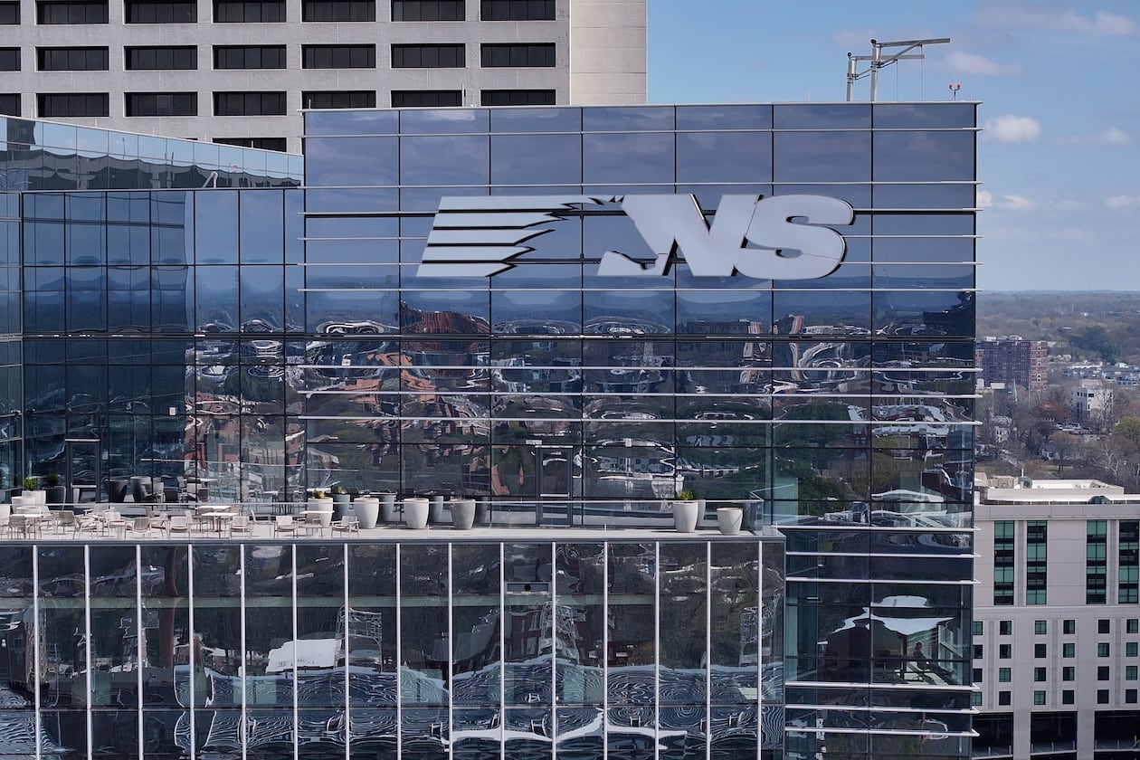 Norfolk Southern headquarters, shown here in an aerial photo on Tuesday, March 10, 2026, sits squarely in the Midtown Atlanta landscape, reflected in its gleaming glass facade. (Hyosub Shin/AJC)