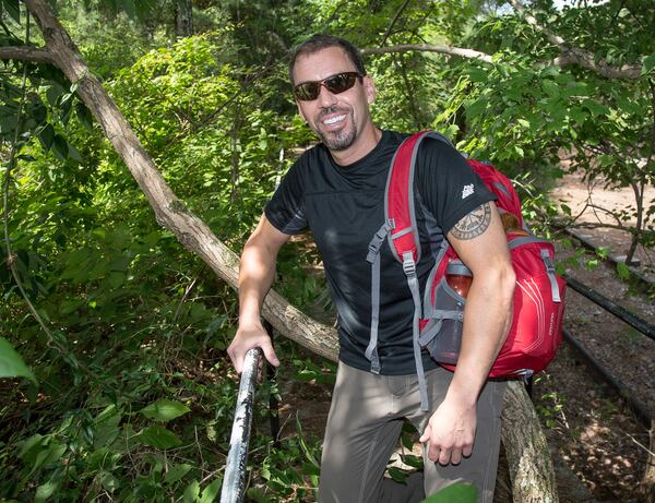 During a stopover in Stone Mountain Park recently, Carl Byington of Ellijay talks about recovering from a serious climbing injury, then running marathons on seven continents. CONTRIBUTED BY STEVE SCHAEFER