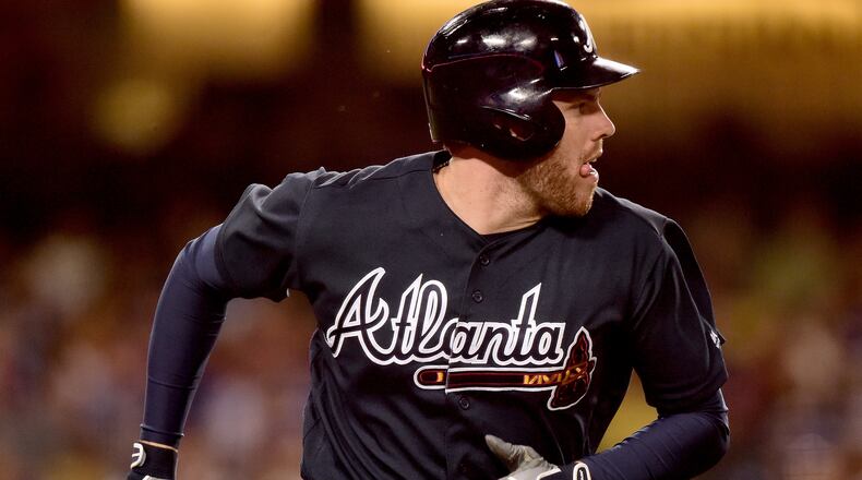 Freddie Freeman was back at first base Tuesday, his third-base days apparently over for the forseeable future. (Photo by Harry How/Getty Images)