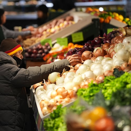 Customers shop at the Reading Terminal Market in Philadelphia, Wednesday, Oct. 29, 2025. (AP Photo/Matt Rourke)