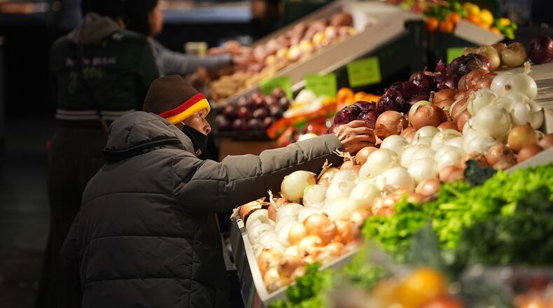 Customers shop at the Reading Terminal Market in Philadelphia, Wednesday, Oct. 29, 2025. (AP Photo/Matt Rourke)