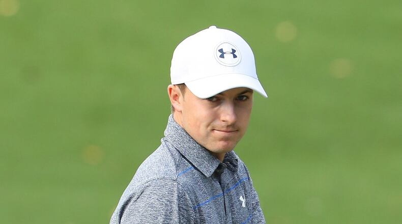 During the second round of the Masters on Friday, Jordan Spieth waves at the gallery gathered at the 10th hole. Spieth, a former Longhorn All-American, shot a second-round 69 to pull within four strokes of the lead. ANDREW REDINGTON/GETTY IMAGES