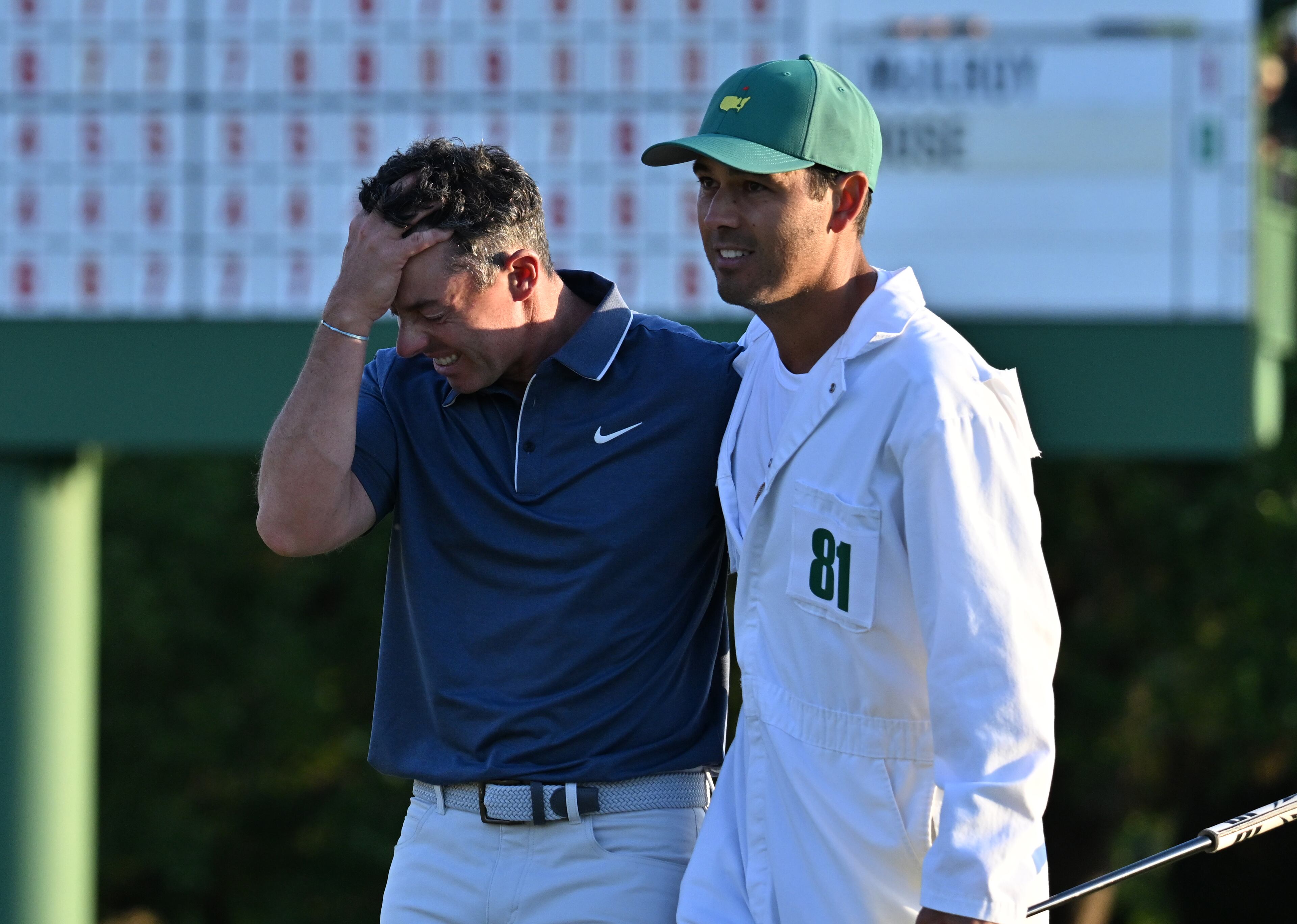 Rory McIlroy celebrates with caddie Harry Diamond, winning the Masters golf tournament with a birdie in the first playoff hole during final round of the Masters golf tournament, at Augusta National Golf Club, Sunday, April 13, 2025, in Augusta, Ga. (Hyosub Shin / AJC)
