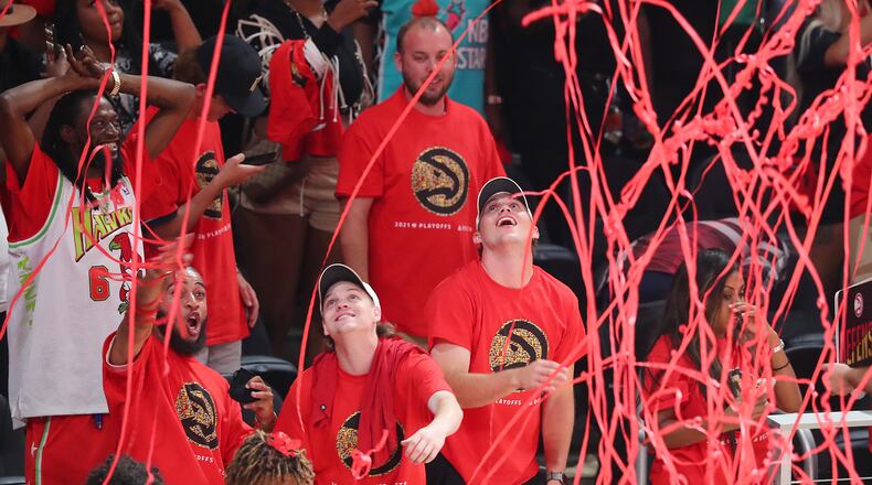 Confetti falls from the ceiling as Atlanta Hawks fans celebrate a 110-88 victory over the Milwaukee Bucks.   “Curtis Compton / Curtis.Compton@ajc.com”