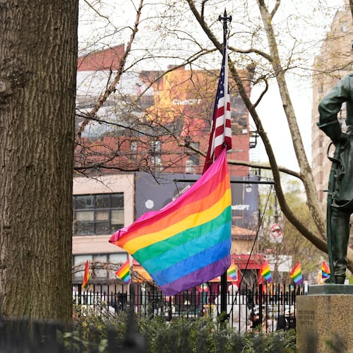 A rainbow Pride flag flies with an American flag at the Stonewall National Monument in New York, Monday, April 13, 2026. (AP Photo/Seth Wenig)