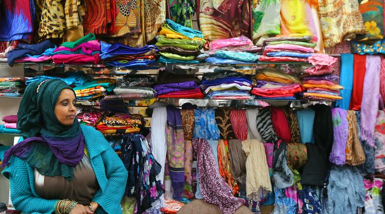 021013 CLARKSTON: Khadra Ahmed sells traditional Islamic wear in her store Khadra Islamic Wear at the Campus Plaza strip mall on Sunday, Feb. 10, 2013, in Clarkston. CURTIS COMPTON / CCOMPTON@AJC.COM