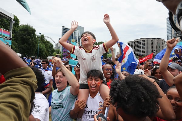 A young Spain fan joins in as Cape Verde fans celebrate at FIFA Fan Festival in Centennial Olympic Park following a 0-0 World Cup draw on Monday, June 15, 2026. (Arvin Temkar/AJC)