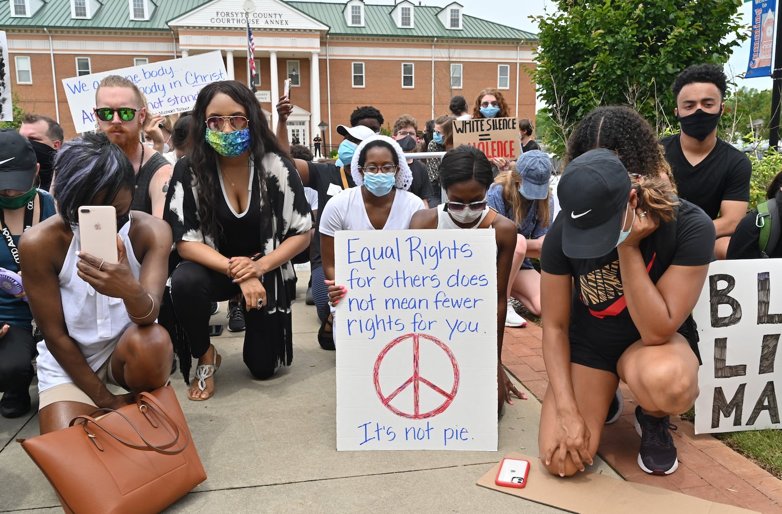 PHOTOS: Protesters demonstrate outside Forsyth County Courthouse