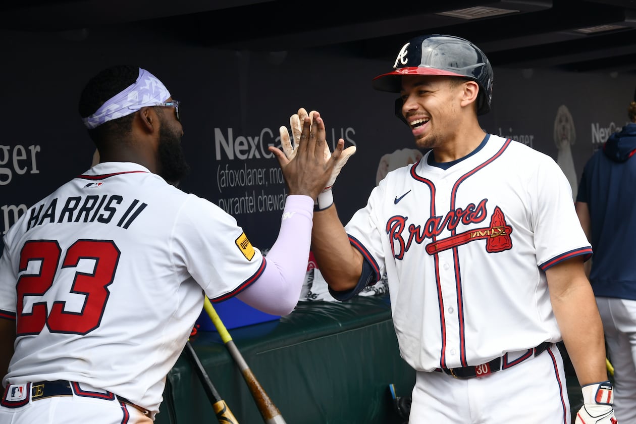 Catcher Drake Baldwin (right) and outfielder Michael Harris II — pictured celebrating Baldwin's home run in September — are all but sure to make the Braves' 26-man roster, but who else is expected to make the cut? (Hyosub Shin / AJC)