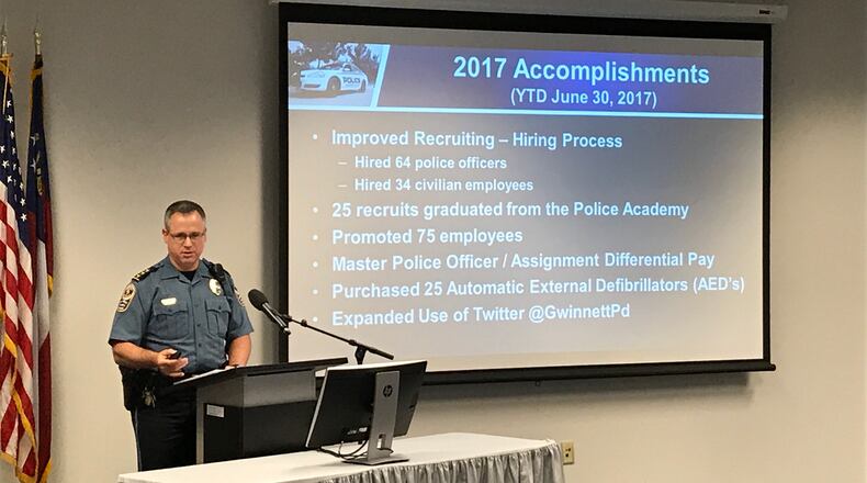 Gwinnett County police Chief Butch Ayers outlines his department’s recent achievements during his 2018 budget proposal in front of Commission Chairman Charlotte Nash on Wednesday. TYLER ESTEP / TYLER.ESTEP@AJC.COM