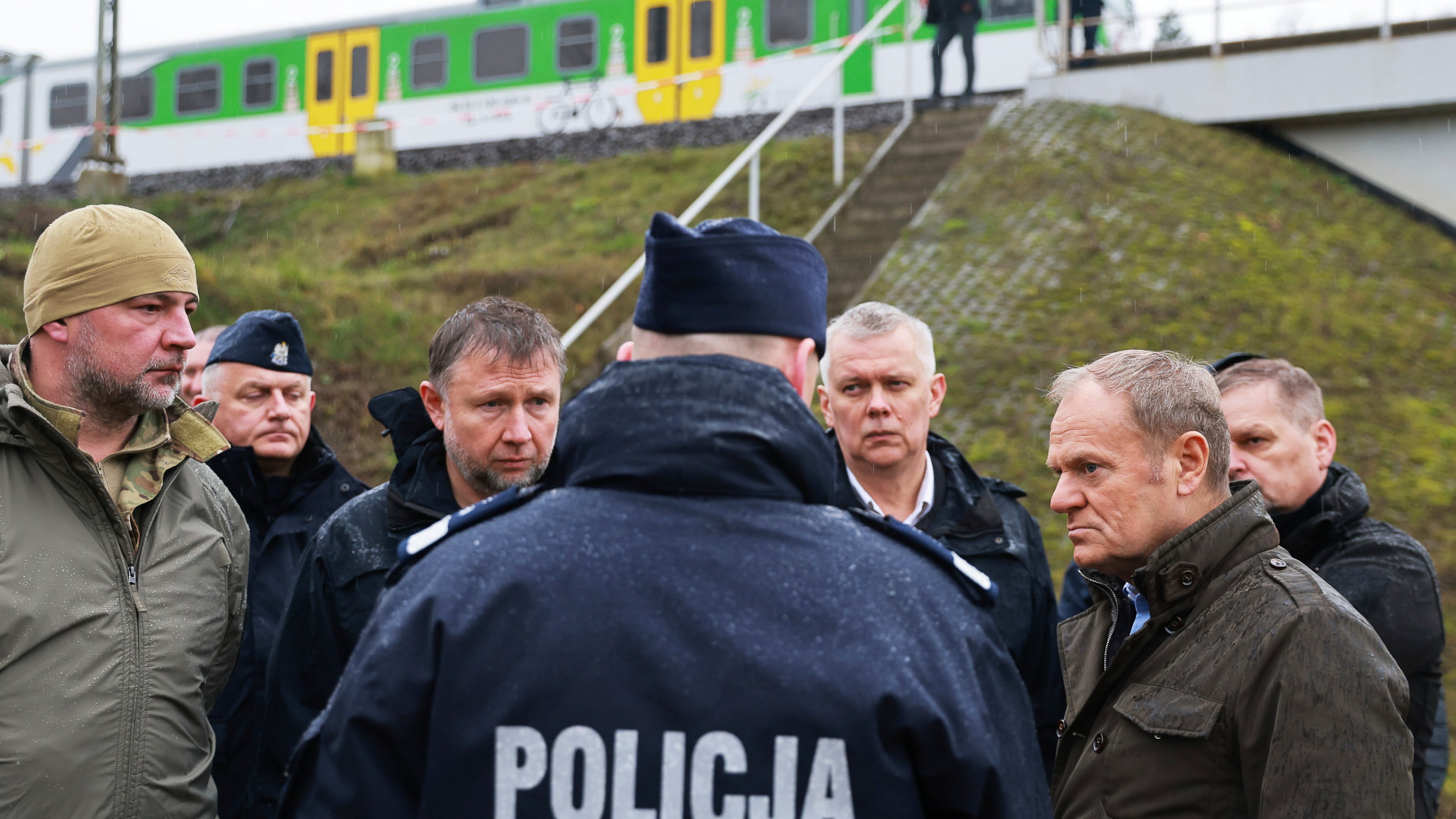 Prime Minister Donald Tusk, second right, visits site of the rail line Mika, that was damaged by sabotage, near Deblin, Poland, Monday, Nov. 17, 2025. (AP Photo/KPRM)