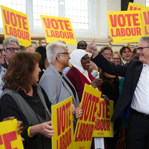 Britain's Prime Minister Keir Starmer gestures to supporters during a visit to All Saints Hall in south London, Tuesday May 5, 2026, whilst campaigning for the upcoming local elections. (Ben Whitley/PA via AP)