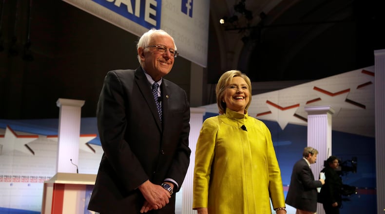 Democratic presidential candidates Bernie Sanders, left, and Hillary Clinton take the stage before a Democratic presidential primary debate at the University of Wisconsin-Milwaukee last week. AP/Tom Lynn