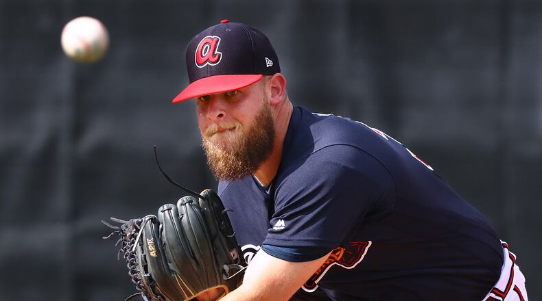 A.J. Minter throws in the bullpen earlier this spring. (Curtis Compton/ccompton@ajc.com)