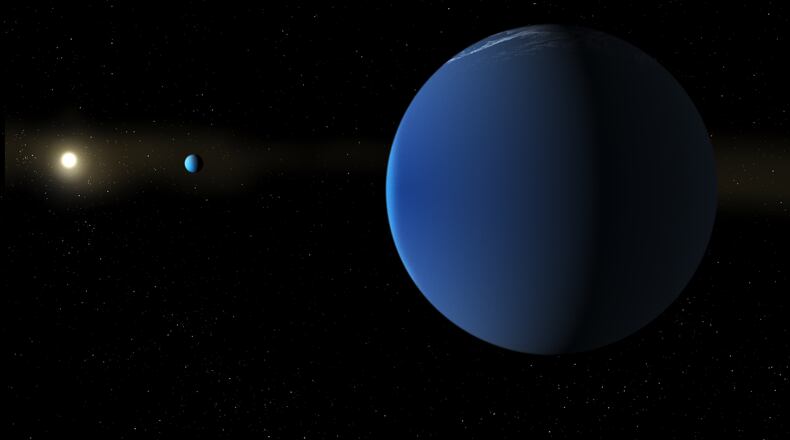 This illustration provided by NASA depicts the Sun-like star TOI-791, background left, and two giant planets that NASA's TESS space telescope discovered in its orbit. (Daniel Rutter/NASA via AP)