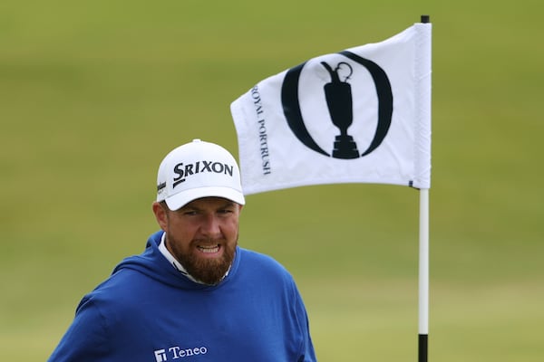 Shane Lowry of Ireland smiles on the 1st green during a practice round for the British Open golf championship at the Royal Portrush Golf Club, Northern Ireland, Tuesday, July 15, 2025. (AP Photo/Peter Morrison)
