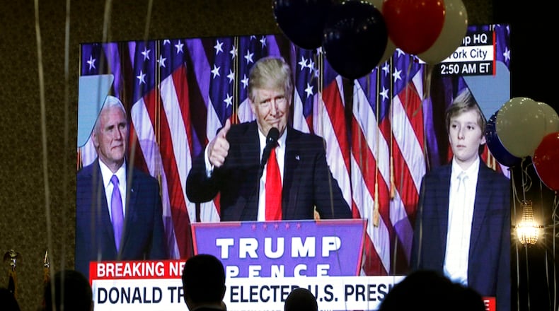 Guests watch a television broadcast of President-elect Donald Trump as he gives his acceptance speech, during an election night event organized by the U.S. Embassy in Skopje, Macedonia, on Wednesday. AP/Boris Grdanoski