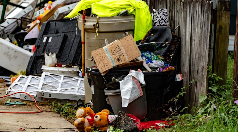 Waste and other materials are often stacked in side yards and near the street at homes with no trash can in Chickasaw, Alabama. (Photo Courtesy of Lee Hedgepeth/Inside Climate News)
