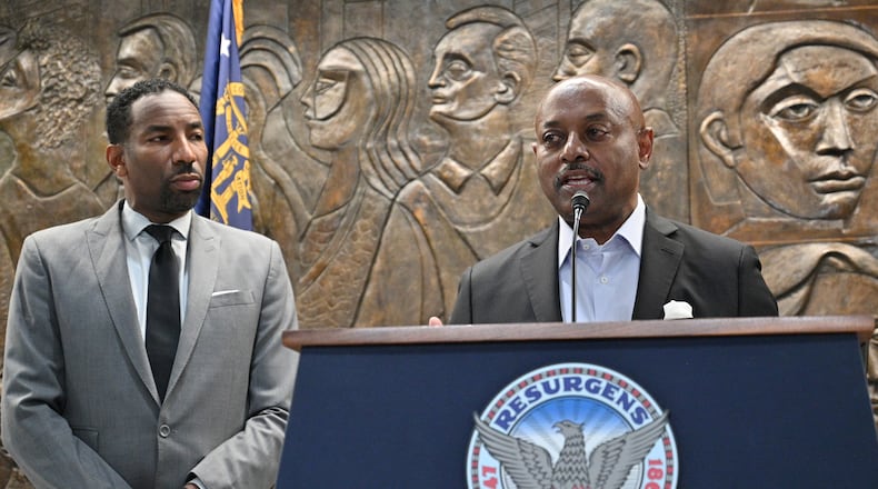 February 3, 2022 Atlanta - Atlanta Housing Authority President Eugene Jones speaks as Mayor Andre Dickens looks during a press conference at Atlanta City Hall on Thursday, February 3, 2022. (Hyosub Shin / Hyosub.Shin@ajc.com)