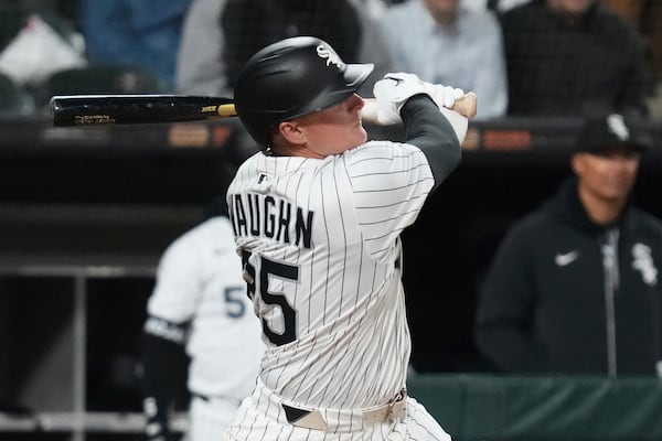 Chicago White Sox's Andrew Vaughn hits a one-run single during the ninth inning of a baseball game against the Seattle Mariners in Chicago, Monday, May 19, 2025. (AP Photo/Nam Y. Huh)