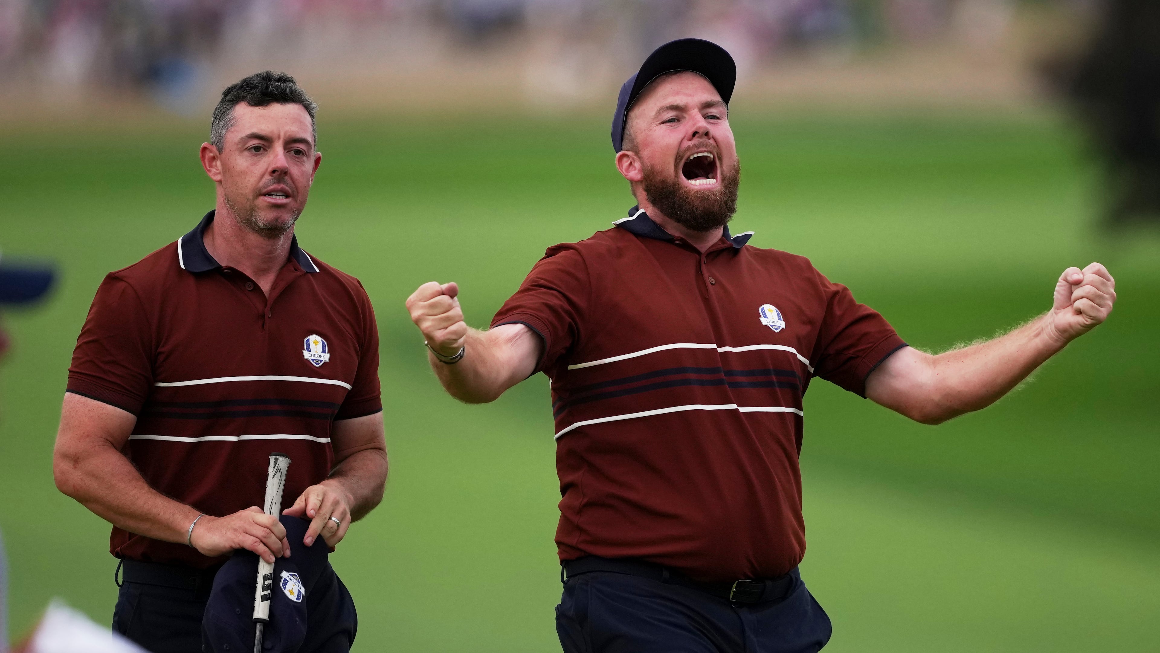 Europe's Shane Lowry and Rory McIlroy react after their match win on the 18th hole at Bethpage Black golf course during the Ryder Cup golf tournament, Saturday, Sept. 27, 2025, in Farmingdale, N.Y. (AP Photo/Matt Slocum)