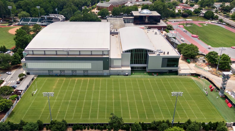 This aerial photo taken on June 11, 2021, by The Atlanta Journal-Constitution shows how the University of Georgia paired its Indoor Athletic Facility (left side) with its new $80 million football operations building (right). Football coach Kirby Smart is now directing donor funds toward increased support personnel, especially in the areas of nutrition, strength and conditioning and training. (Hyosub Shin / Hyosub.Shin@ajc.com)