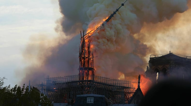Flames rise from the Notre Dame Cathedral as it burns in Paris on April 15, 2019. SIPA VIA AP IMAGES