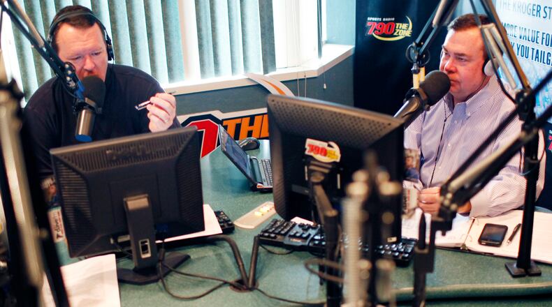 In this November, 22, 2010 photo, Wes Durham (left) and Tony Barnhart (right) talk during a broadcast of their show in the 790 The Zone studios in Buckhead.