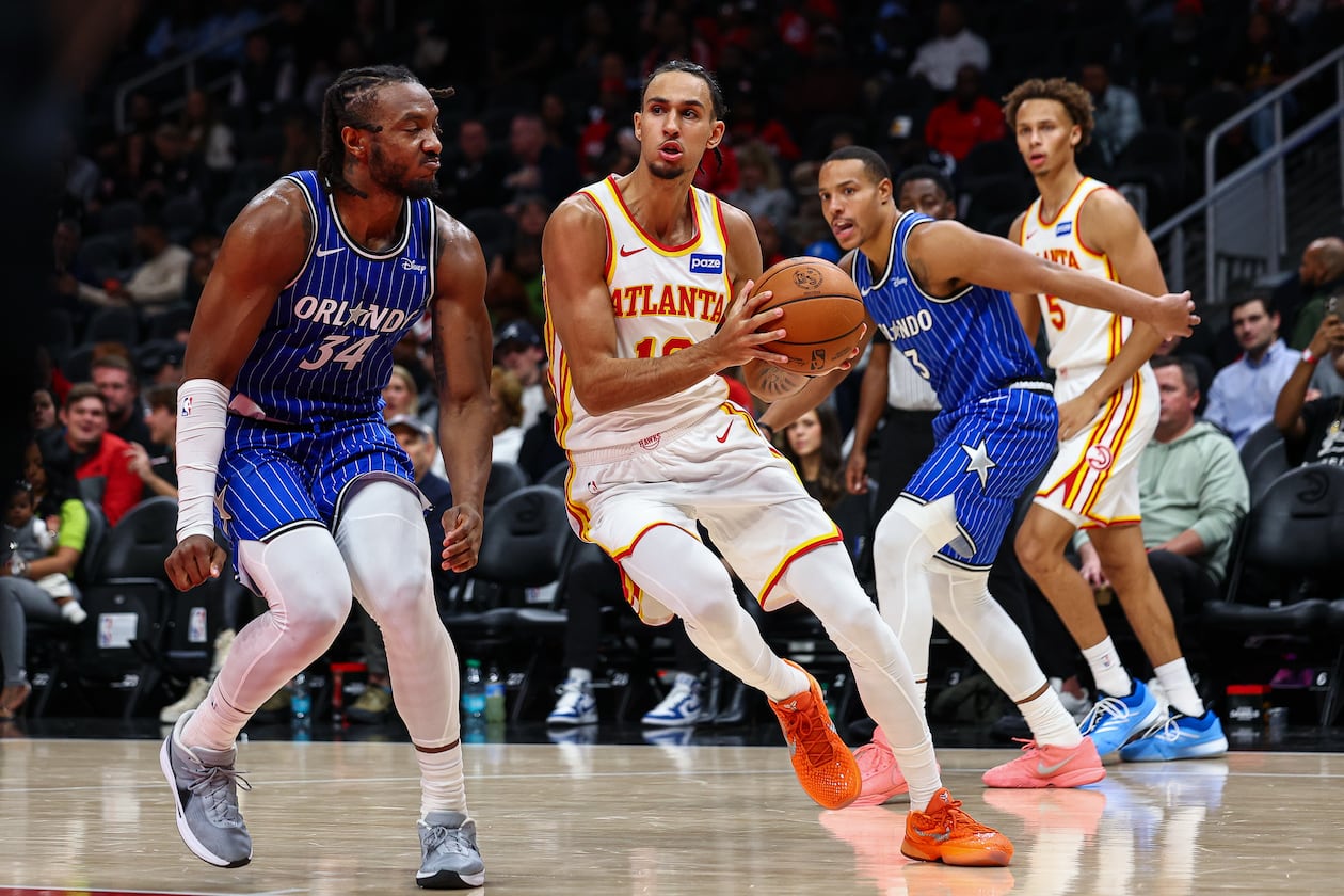 Atlanta Hawks forward Zaccharie Risacher, center, drives to the basket during the first half of an NBA basketball game against the Orlando Magic, Tuesday, Nov. 4, 2025, in Atlanta. (Colin Hubbard/AP)