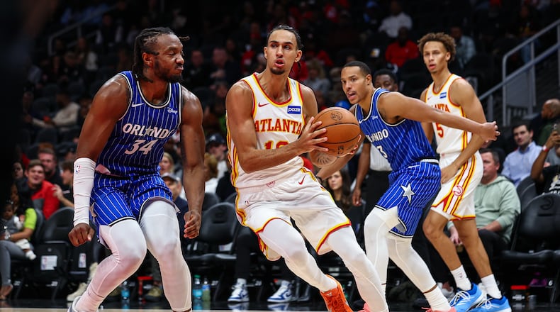 Atlanta Hawks forward Zaccharie Risacher, center, drives to the basket during the first half of an NBA basketball game against the Orlando Magic, Tuesday, Nov. 4, 2025, in Atlanta. (Colin Hubbard/AP)