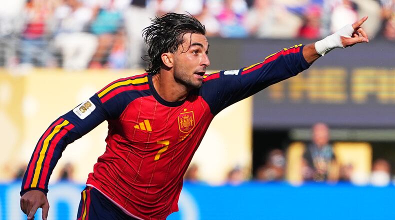 Spain's Ferran Torres (7) celebrates scoring their first goal during the World Cup final soccer match between Spain and Argentina in East Rutherford, N.J., near New York, Sunday, July 19, 2026. (AP Photo/Julio Cortez)