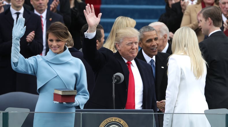 President Donald Trump and First Lady Melania Trump wave to the crowd as former president Barack Obama greets Tiffany Trump on the West Front of the U.S. Capitol. (Photo by Alex Wong/Getty Images)