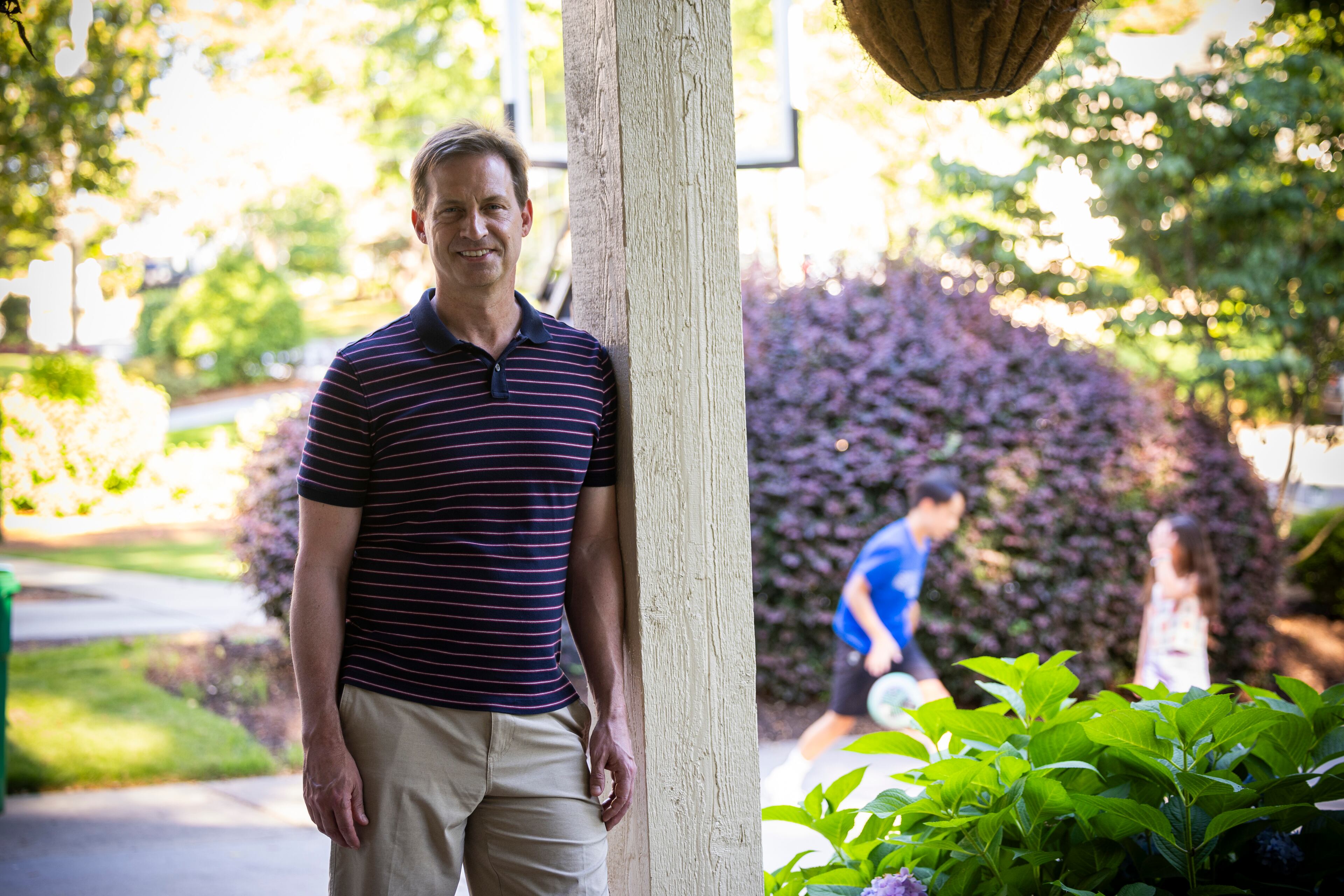Dr. James Rilling, psychology professor at Emory University and director of the Laboratory for Darwinian Neuroscience, poses for a quick photo while spending time with his children outside. (Courtesy of Kay Hinton, Emory University)