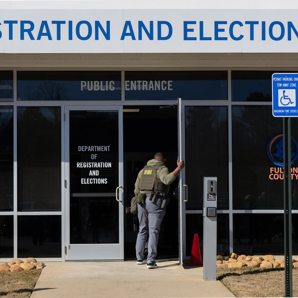 An FBI agent enters the Fulton County Election Hub and Operation Center in Union City on Wednesday, Jan. 28, 2026. (Arvin Temkar/AJC)