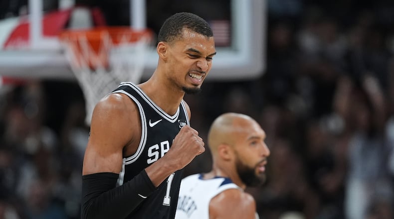 San Antonio Spurs forward Victor Wembanyama (1) reacts to a play against the Minnesota Timberwolves during the second half of Game 5 of an NBA basketball second-round playoffs series in Minneapolis, Tuesday, May 12, 2026. (AP Photo/Eric Gay)