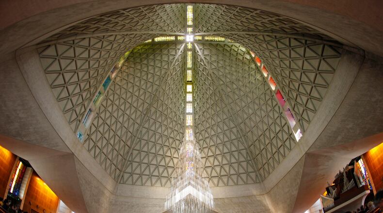 FILE - Parishioners attend a service at St. Mary's Cathedral, the mother church of the archdiocese in San Francisco, on April 2, 2010. (AP Photo/Eric Risberg, File)