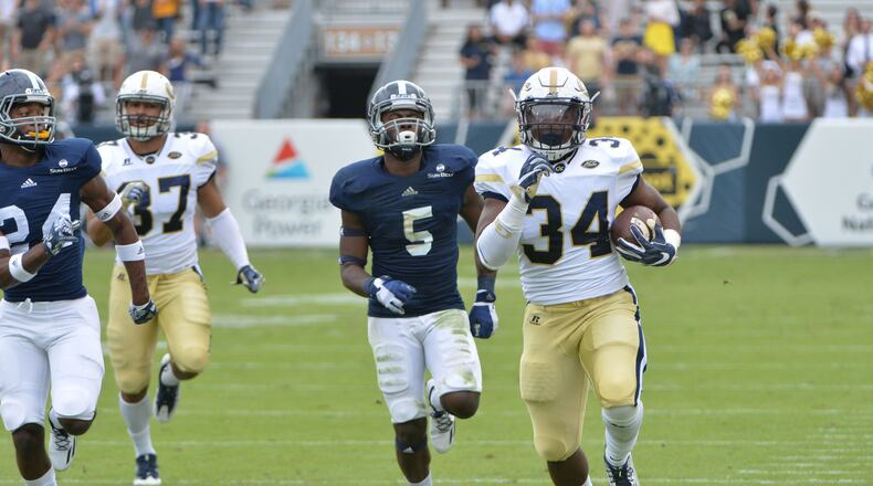Georgia Tech running back Marcus Marshall (34) runs past Georgia Southern cornerback Darius Jones Jr. (5) in the first half at Bobby Dodd Stadium on Saturday, October 15, 2016. HYOSUB SHIN / HSHIN@AJC.COM