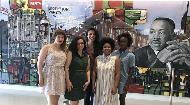 Artists Haylee Anne (from left), Angela Bortone, Jessica Caldas, Angela Davis Johnson, and Danielle Deadwyler created the exhibit “Live the Legacy II” for the Center for Civil and Human Rights. FLEMING SMITH / MARGARET.SMITH@COXINC.COM