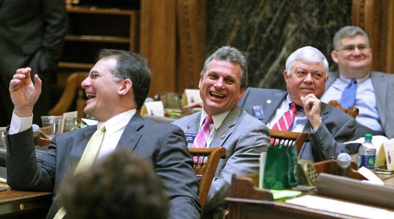 Buddy Carter, second from left, in 2013. JASON GETZ / JGETZ@AJC.COM