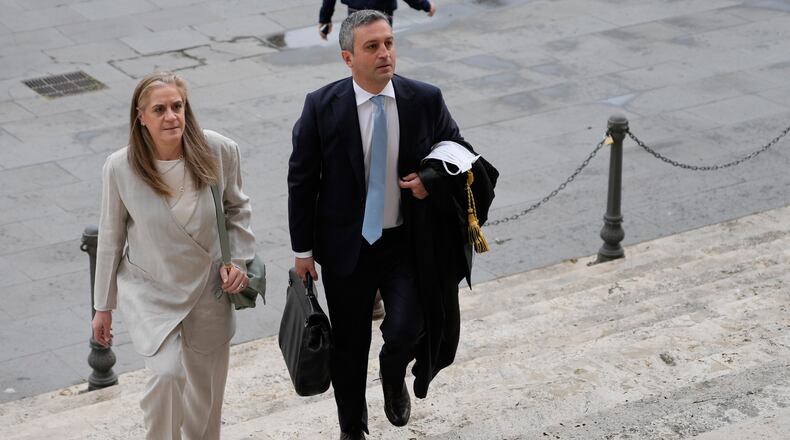 Italian lawyers Marco Mellone, right, and Graziella Cerulli arrive at Italy's highest Court of Cassation, in Rome, Tuesday, April 14, 2026, to argue against the new citizenship law that restricts citizenship by descent. (AP Photo/Gregorio Borgia)