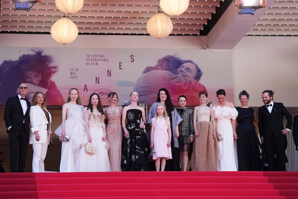 Producer Lucas Schmidt, from left, producer Maren Schmitt, Luzia Oppermann, Laeni Geiseler, Susanne Wust, from sixth left, Hanna Heckt, director Mascha Schilinski, Lena Urzendowsky, Lea Drinda, Luise Heyer, writer Louise Peters and cinematographer Fabian Gamper pose for photographers upon arrival at the premiere of the film 'Sound of Falling' at the 78th international film festival, Cannes, southern France, Wednesday, May 14, 2025. (Photo by Lewis Joly/Invision/AP)