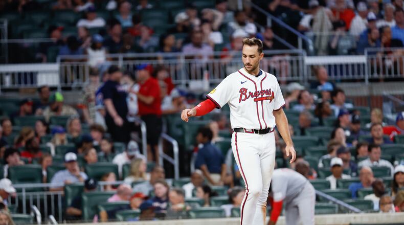 Matt Olson tosses his helmet after striking out during Monday's loss to the Reds at Truist Park.